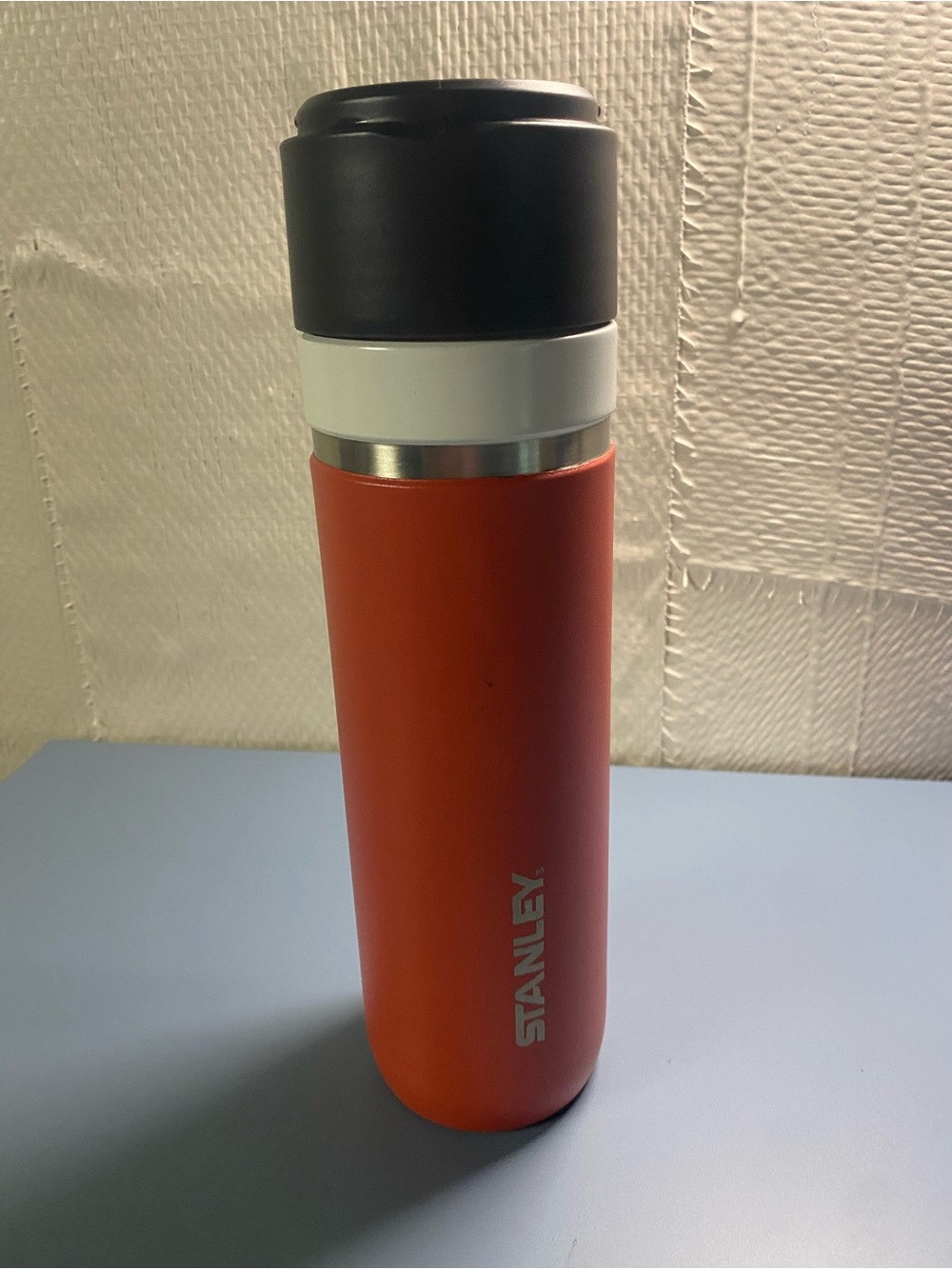 Stanley Orange Tumbler with Black Lid and White Band